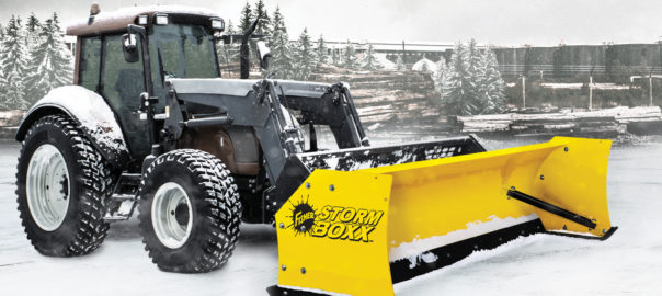 Fisher Steel Edge Storm Boxx mounted on a tractor in winter